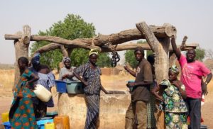 6886675 - wassadou,senegal - february 13,2007 : all the people working in the extraction of water from the well in the peul ethnic village.